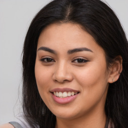 Joyful asian young-adult female with long  brown hair and brown eyes