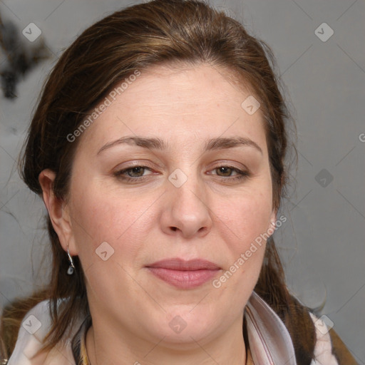 Joyful white adult female with medium  brown hair and blue eyes