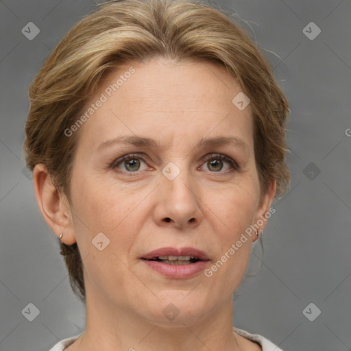 Joyful white adult female with medium  brown hair and grey eyes