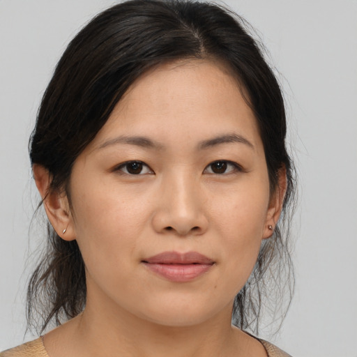 Joyful asian young-adult female with medium  brown hair and brown eyes