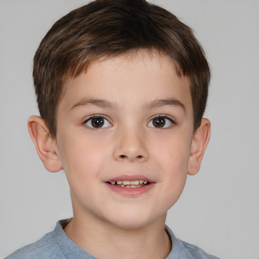 Joyful white child male with short  brown hair and brown eyes