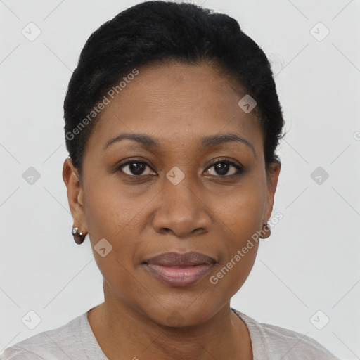 Joyful black young-adult female with short  black hair and brown eyes
