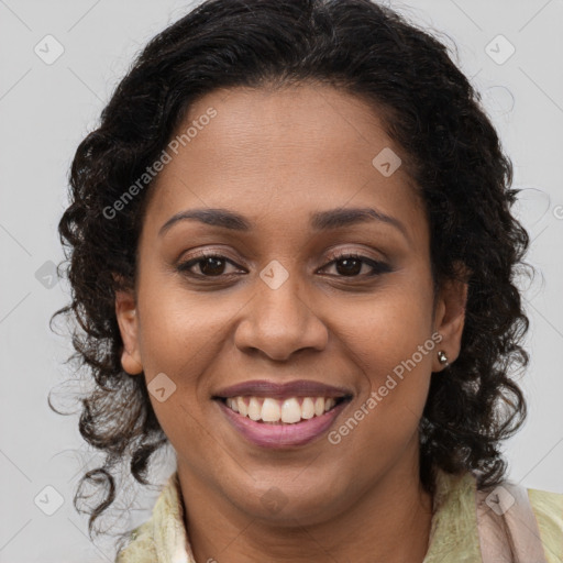 Joyful black young-adult female with long  brown hair and brown eyes