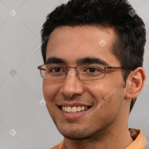 Joyful white young-adult male with short  black hair and brown eyes