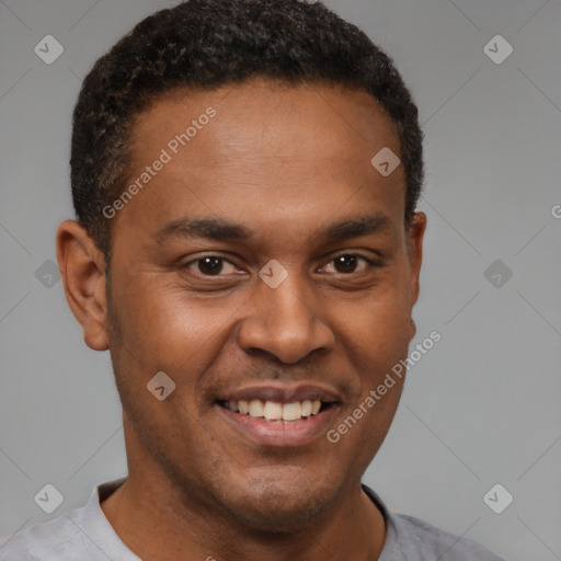 Joyful latino young-adult male with short  brown hair and brown eyes