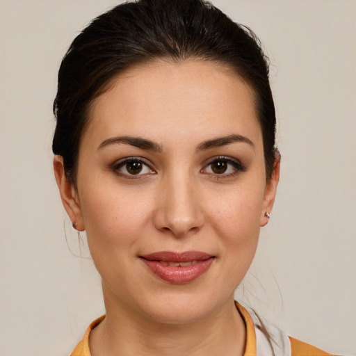 Joyful white young-adult female with medium  brown hair and brown eyes