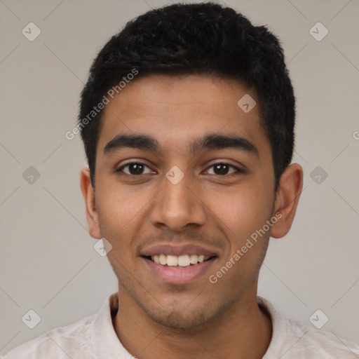 Joyful latino young-adult male with short  black hair and brown eyes