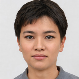 Joyful asian young-adult female with short  black hair and brown eyes