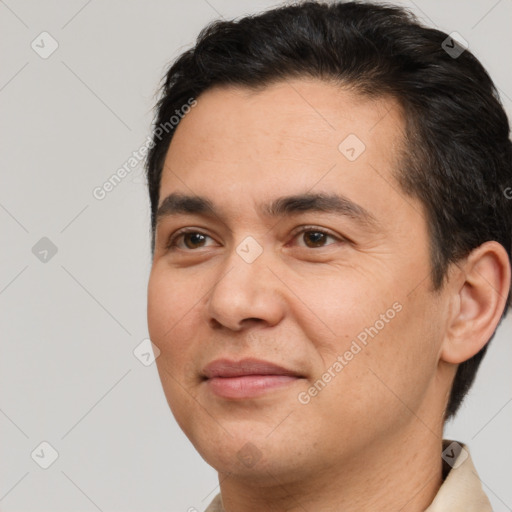 Joyful white adult male with short  brown hair and brown eyes