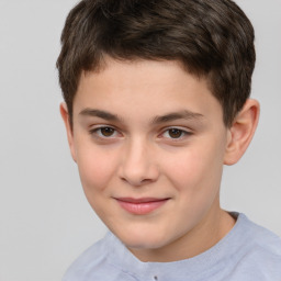 Joyful white child male with short  brown hair and brown eyes