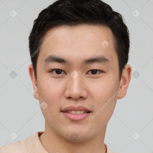 Joyful asian young-adult male with short  brown hair and brown eyes