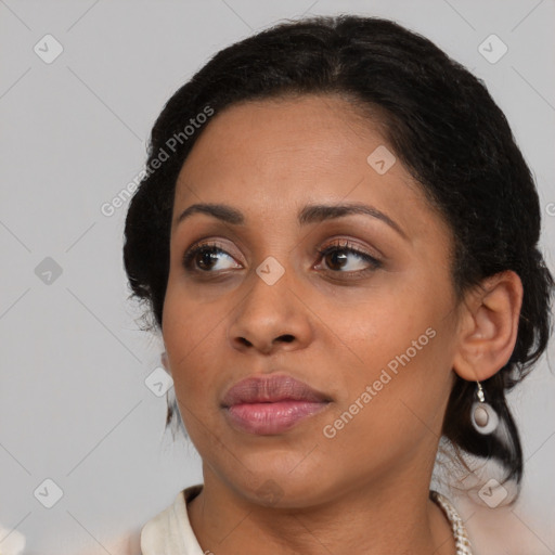 Joyful latino young-adult female with medium  black hair and brown eyes