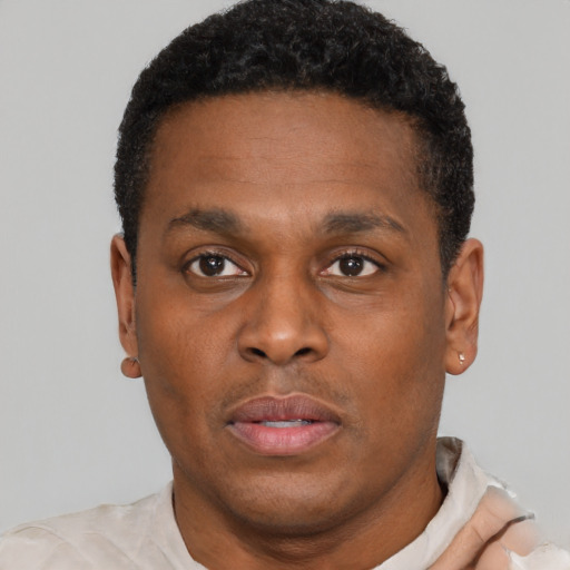 Neutral black young-adult male with short  brown hair and brown eyes