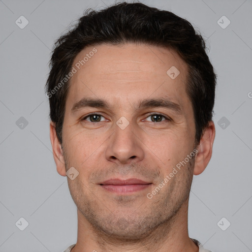 Joyful white adult male with short  brown hair and brown eyes