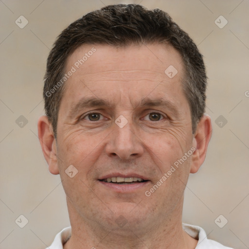 Joyful white adult male with short  brown hair and brown eyes