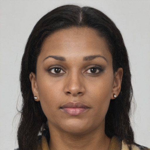 Neutral black young-adult female with long  brown hair and brown eyes