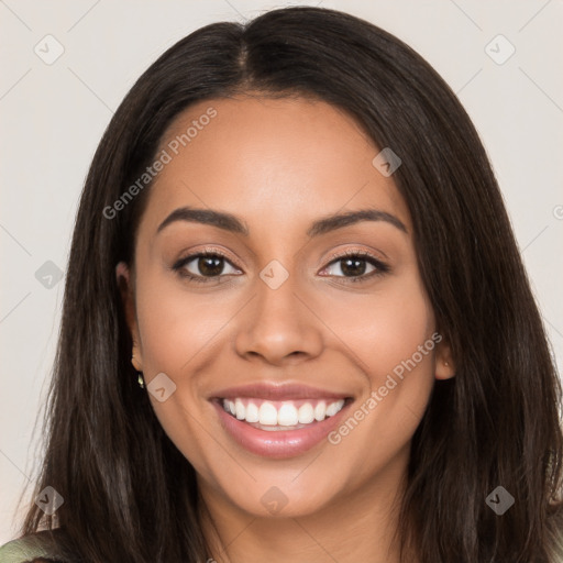 Joyful latino young-adult female with long  brown hair and brown eyes