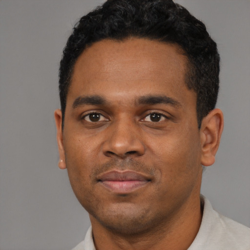 Neutral black young-adult male with short  black hair and brown eyes