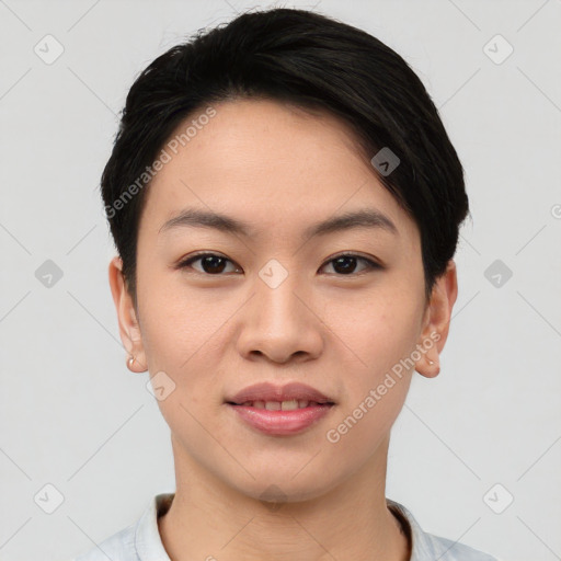 Joyful asian young-adult female with short  black hair and brown eyes