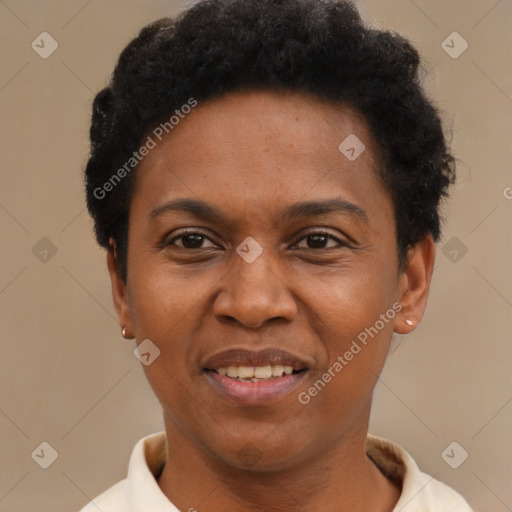 Joyful black adult female with short  black hair and brown eyes