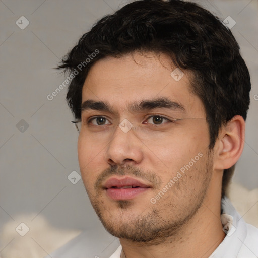 Joyful white adult male with short  black hair and brown eyes