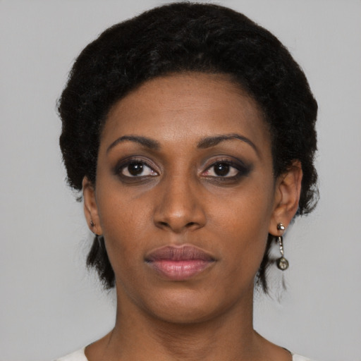 Neutral black young-adult female with short  black hair and brown eyes