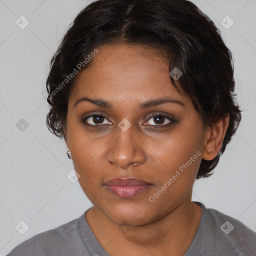 Neutral black young-adult female with medium  brown hair and brown eyes