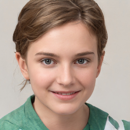 Joyful white child female with short  brown hair and grey eyes