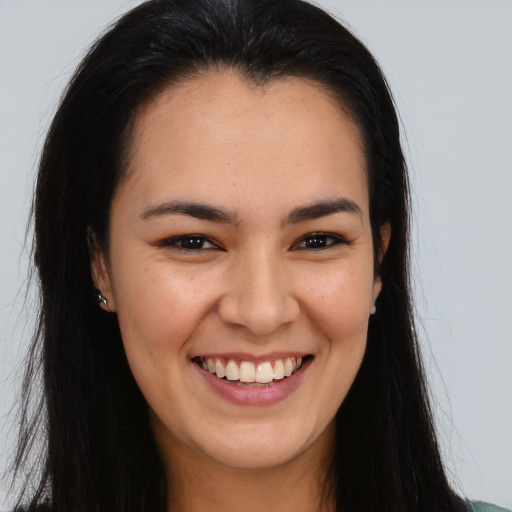 Joyful asian young-adult female with long  brown hair and brown eyes