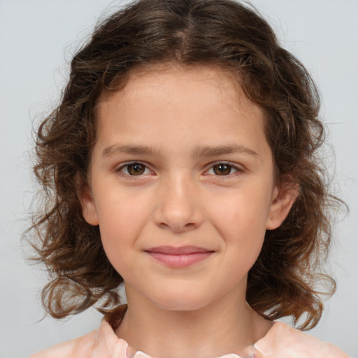 Joyful white child female with medium  brown hair and brown eyes