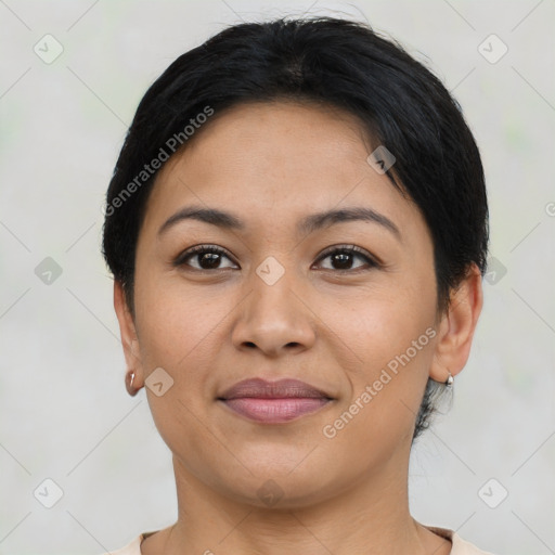 Joyful latino young-adult female with short  brown hair and brown eyes