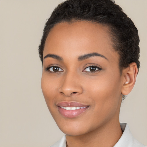 Joyful latino young-adult female with short  brown hair and brown eyes