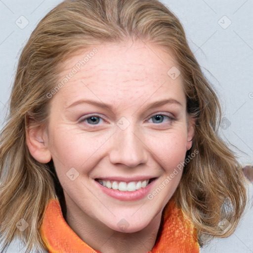 Joyful white young-adult female with medium  brown hair and blue eyes