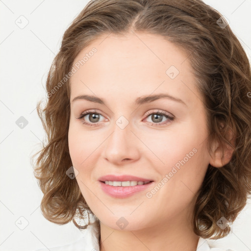 Joyful white young-adult female with medium  brown hair and green eyes