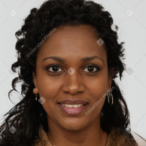 Joyful black young-adult female with long  black hair and brown eyes