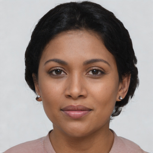 Joyful latino young-adult female with short  brown hair and brown eyes