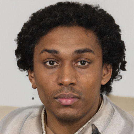Neutral black young-adult female with short  black hair and brown eyes