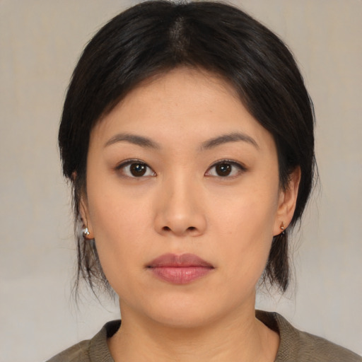 Neutral asian young-adult female with medium  black hair and brown eyes