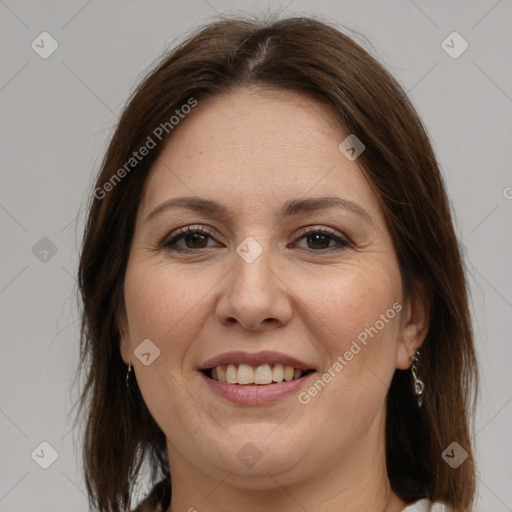 Joyful white adult female with medium  brown hair and grey eyes