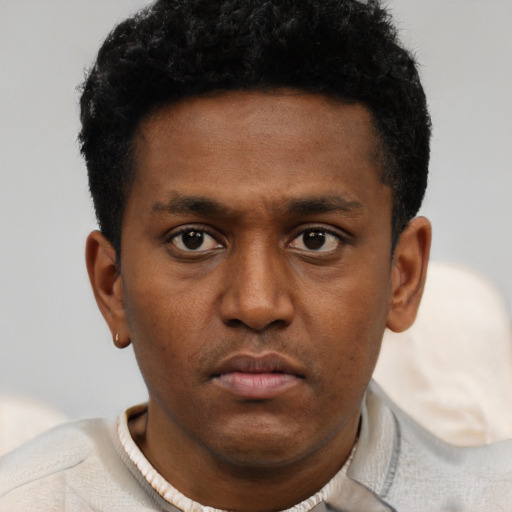 Neutral latino young-adult male with short  brown hair and brown eyes