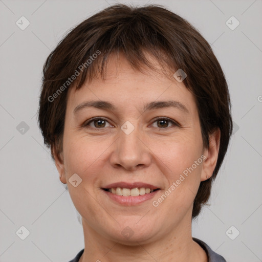 Joyful white adult female with medium  brown hair and brown eyes