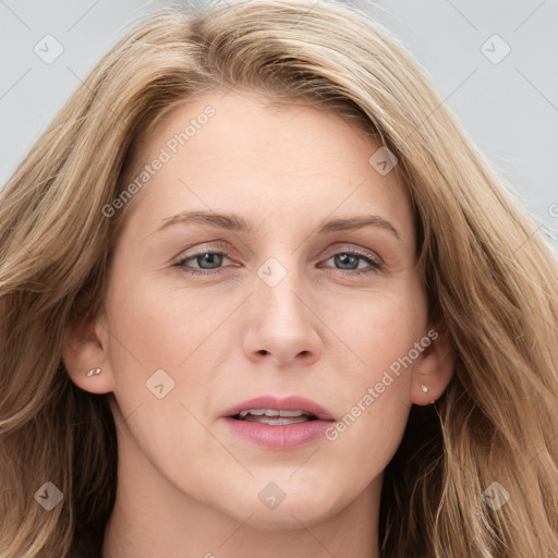 Joyful white young-adult female with long  brown hair and blue eyes