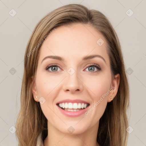 Joyful white young-adult female with long  brown hair and green eyes