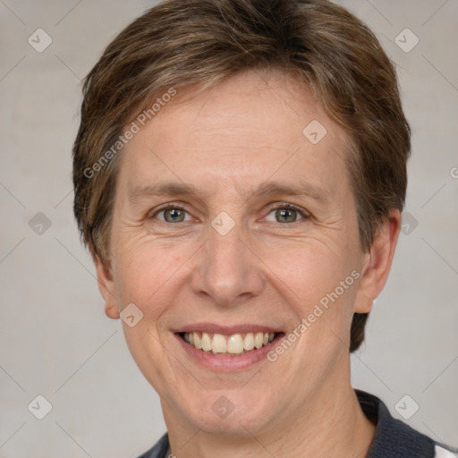 Joyful white adult female with short  brown hair and grey eyes