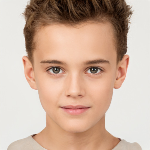 Joyful white child male with short  brown hair and brown eyes