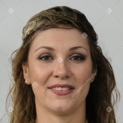 Joyful white adult female with long  brown hair and brown eyes