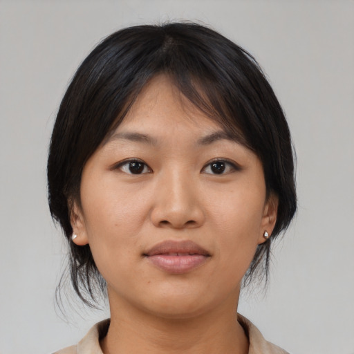 Neutral asian young-adult female with medium  brown hair and brown eyes