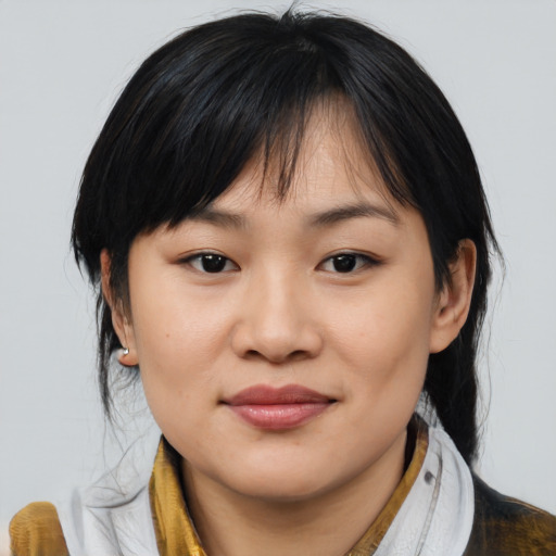 Joyful asian young-adult female with medium  brown hair and brown eyes