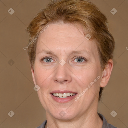 Joyful white adult female with short  brown hair and grey eyes