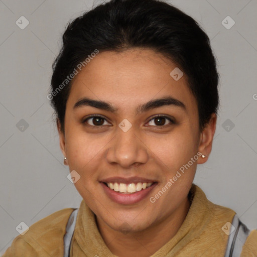 Joyful latino young-adult female with short  brown hair and brown eyes